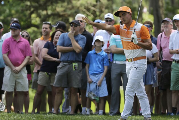 Rickie Fowler reacts to his shot from the rough on the fourth hole during the final round of the Wells Fargo Championship golf tournament at Quail Hollow Club in Charlotte, N.C., Sunday, May 8, 2016. (AP Photo/Chuck Burton)