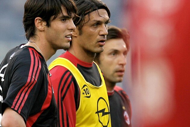 Barcelona, SPAIN:  AC Milan's Kaka (L), Paolo Maldini and Andrea Pirlo (R) stand during a training session at the Camp Nou stadium in Barcelona, 25 April 2006 on the eve of their Champions League semi-final second leg football match against Barcelona. AFP PHOTO/FILIPPO MONTEFORTE  (Photo credit should read FILIPPO MONTEFORTE/AFP/Getty Images)