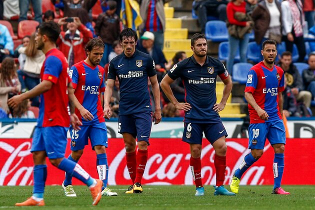 Atletico Madrid's Montenegrin defender Stefan Savic (C L) and Atletico Madrid's midfielder Koke (C R) stand on the pitch at the end of the Spanish league football match Levante UD vs Club Atletico de Madrid at the Ciutat de Valencia stadium in Valencia on May 8, 2016. / AFP / BIEL ALINO (Photo credit should read BIEL ALINO/AFP/Getty Images) Atletico Madrid's Montenegrin defender Stefan Savic (C L) and Atletico Madrid's midfielder Koke (C R) stand on the pitch at the end of the Spanish league football match Levante UD vs Club Atletico de Madrid at the Ciutat de Valencia stadium in Valencia on May 8, 2016. / AFP / BIEL ALINO (Photo credit should read BIEL ALINO/AFP/Getty Images)