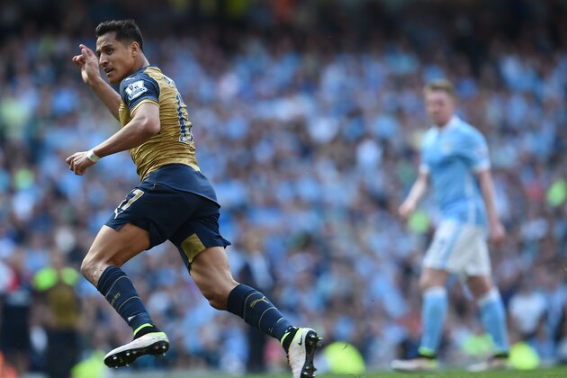Arsenal's Chilean striker Alexis Sanchez celebrates after scoring during the English Premier League football match between Manchester City and Arsenal at the Etihad Stadium in Manchester, north west England, on May 8, 2016. / AFP / PAUL ELLIS / RESTRICTED TO EDITORIAL USE. No use with unauthorized audio, video, data, fixture lists, club/league logos or 'live' services. Online in-match use limited to 75 images, no video emulation. No use in betting, games or single club/league/player publications.  /         (Photo credit should read PAUL ELLIS/AFP/Getty Images)