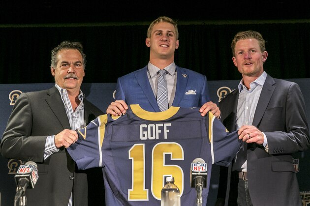 Los Angeles Rams head coach Jeff Fisher, left, Jared Goff and general manager Les Snead pose for photos after Goff was introduced by the team as the first pick in the first round of the NFL football draft, in Los Angeles, Friday, April 29, 2016. (AP Photo/Damian Dovarganes)