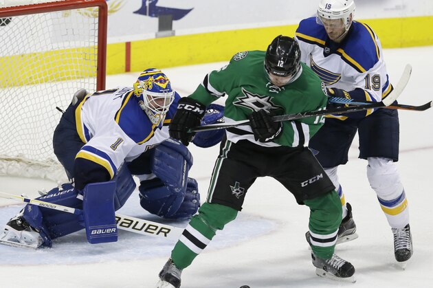 St. Louis Blues goalie Brian Elliott (1) and defenseman Jay Bouwmeester (19) defend the goal against Dallas Stars center Radek Faksa (12) during the third period of Game 5 of the NHL hockey Stanley Cup Western Conference semifinals Saturday, May 7, 2016, in Dallas. The Blues won 4-1. (AP Photo/LM Otero)