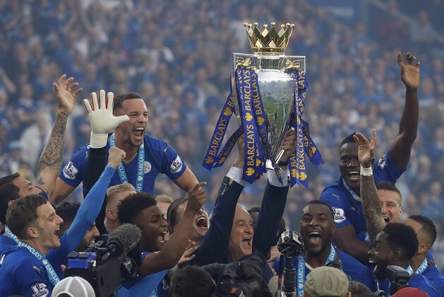 Leicester players and squad members lift the trophy as Leicester City celebrate becoming the English Premier League soccer champions at King Power stadium in Leicester, England, Saturday, May 7, 2016.(AP Photo/Matt Dunham)