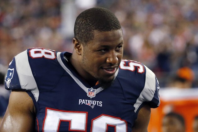 New England Patriots linebacker Jon Bostic speaks to a teammate on the sideline in the first half an NFL football game against the Miami Dolphins, Thursday, Oct. 29, 2015, in Foxborough, Mass. (AP Photo/Michael Dwyer)