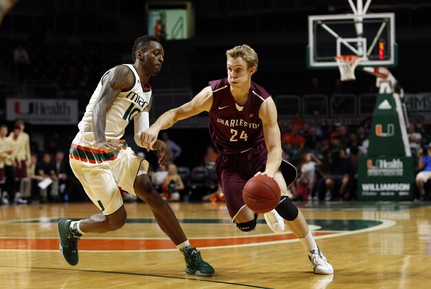 Dec 19, 2015; Coral Gables, FL, USA; Charleston Cougars guard Canyon Barry (24) drives to the basket as Miami Hurricanes guard Sheldon McClellan (10) defends during the first half at BankUnited Center. Mandatory Credit: Steve Mitchell-USA TODAY Sports
