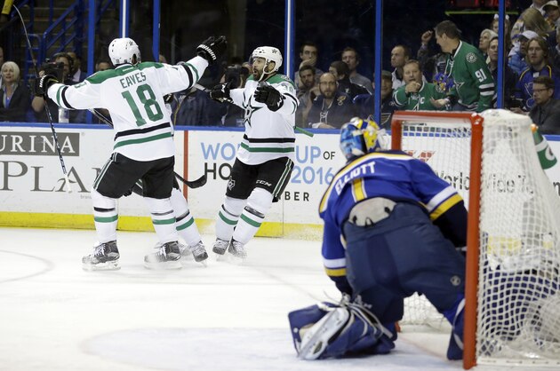 Dallas Stars' Vernon Fiddler, center, is congratulated by Patrick Eaves, left, after scoring past St. Louis Blues goalie Brian Elliott, right, during the first period of Game 6 of the NHL hockey Stanley Cup Western Conference semifinals, Monday, May 9, 2016, in St. Louis. (AP Photo/Jeff Roberson)