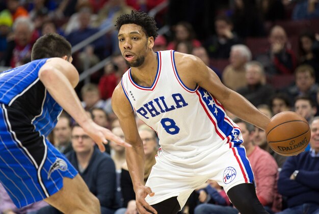 Feb 23, 2016; Philadelphia, PA, USA; Philadelphia 76ers center Jahlil Okafor (8) attempts to drive past the defense of Orlando Magic center Nikola Vucevic (9) during the first half at Wells Fargo Center. Mandatory Credit: Bill Streicher-USA TODAY Sports