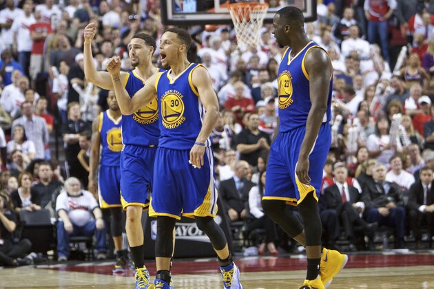 Golden State Warriors guard Stephen Curry, center, guard Klay Thompson, left, and forward Draymond Green, right, react during the second half of Game 4 of an NBA basketball second-round playoff series against the Portland Trail Blazers Monday, May 9, 2016, in Portland, Ore. The Warriors won 132-125. (AP Photo/Craig Mitchelldyer)