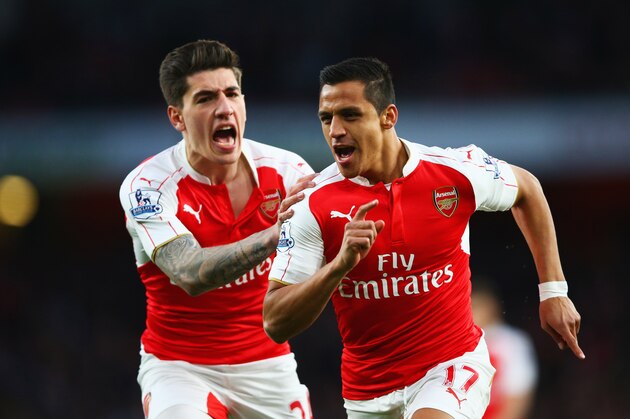LONDON, ENGLAND - APRIL 21:  Alexis Sanchez of Arsenal (R) celebrates with Hector Bellerin as he scores their first goal during the Barclays Premier League match between Arsenal and West Bromwich Albion at the Emirates Stadium on April 21, 2016 in London, England.  (Photo by Paul Gilham/Getty Images)