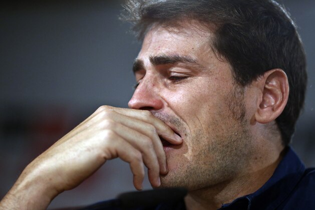 Real Madrid's goalkeeper Iker Casillas reacts during press conference at the Santiago Bernabeu stadium in Madrid, Spain, Sunday, July 12, 2015. Casillas is leaving Real Madrid to join Portuguese club FC Porto after 16 seasons in which he helped the Spanish powerhouse win a slew of titles that included three Champions League crowns and five Spanish league trophies Casillas, 34, joined the club's youth academy at age 9 before debuting for its first team in 1999. (AP Photo/Oscar del Pozo) Real Madrid's goalkeeper Iker Casillas reacts during press conference at the Santiago Bernabeu stadium in Madrid, Spain, Sunday, July 12, 2015. Casillas is leaving Real Madrid to join Portuguese club FC Porto after 16 seasons in which he helped the Spanish powerhouse win a slew of titles that included three Champions League crowns and five Spanish league trophies Casillas, 34, joined the club's youth academy at age 9 before debuting for its first team in 1999. (AP Photo/Oscar del Pozo)