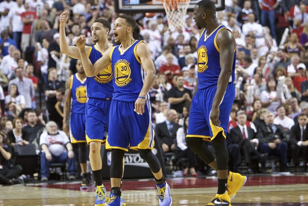 Golden State Warriors guard Stephen Curry, center, guard Klay Thompson, left, and forward Draymond Green, right, react during the second half of Game 4 of an NBA basketball second-round playoff series against the Portland Trail Blazers Monday, May 9, 2016, in Portland, Ore. The Warriors won 132-125. (AP Photo/Craig Mitchelldyer)