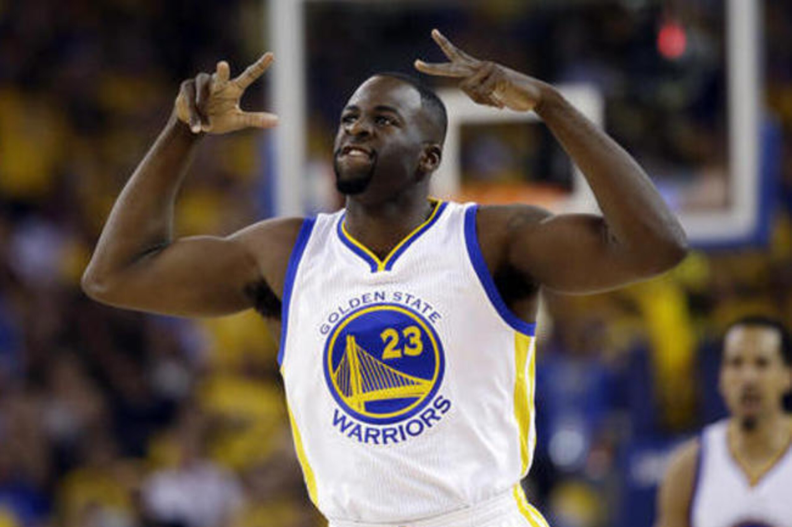 Golden State Warriors' Draymond Green (23) reacts after scoring against the Houston Rockets during the first half in Game 5 of a first-round NBA basketball playoff series Wednesday, April 27, 2016, in Oakland, Calif. (AP Photo/Marcio Jose Sanchez)