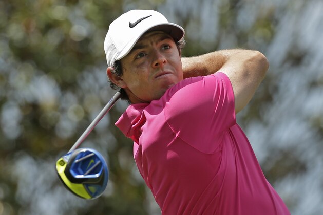 Rory McIlroy watches his tee shot on the 15th hole during the final round of the Wells Fargo Championship golf tournament at Quail Hollow Club in Charlotte, N.C., Sunday, May 8, 2016. (AP Photo/Chuck Burton)