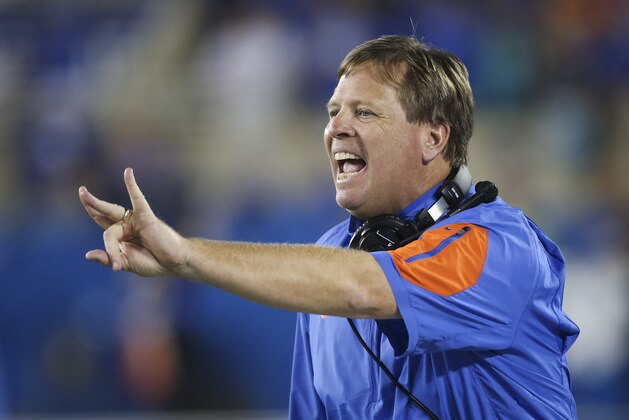 FILE - In this Sept. 19, 2015, file photo, Florida head coach Jim McElwain instructs his team during the second half of an NCAA college football game against Kentucky, in Lexington, Ky.  McElwain has genuine reverence for Alabama's Nick Saban. It's obvious when McElwain talks about his former boss and even more evident in how he's rebuilding the program in Gainesville.  (AP Photo/David Stephenson, File)