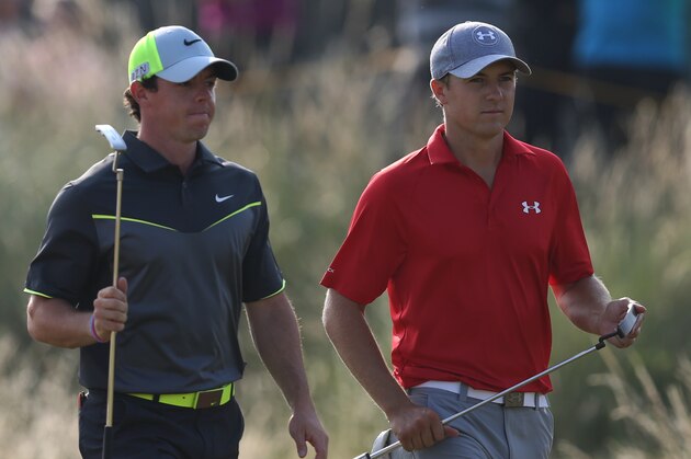Rory McIlroy of Northern Ireland, left, and Jordan Spieth of the US walk up to the 14th tee box during the second day of the British Open Golf championship at the Royal Liverpool golf club, Hoylake, England, Friday July 18, 2014. (AP Photo/Scott Heppell)