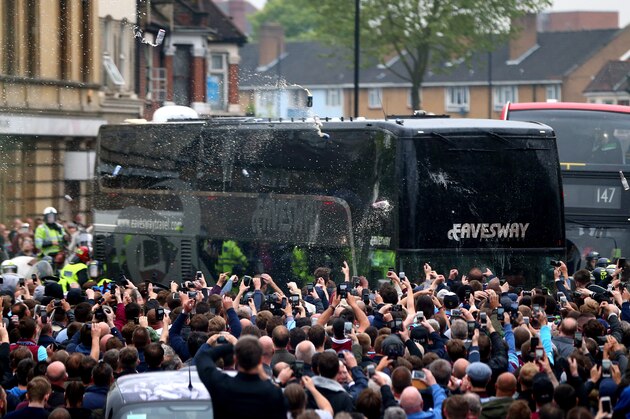 LONDON, ENGLAND - MAY 10:  Bottles, beer and missiles are thrown at the Manchester United team bus as it tries to make it's way through the crowds that had congregated in the street prior to the Barclays Premier League match between West Ham United and Manchester United on May 10, 2016 in London, United Kingdom.  (Photo by Catherine Ivill - AMA/Getty Images)