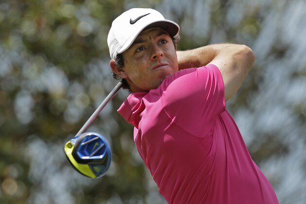 Rory McIlroy watches his tee shot on the 15th hole during the final round of the Wells Fargo Championship golf tournament at Quail Hollow Club in Charlotte, N.C., Sunday, May 8, 2016. (AP Photo/Chuck Burton)