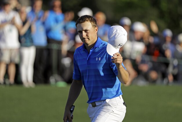 Jordan Spieth tips his cap on the 18th fairway during the final round of the Masters golf tournament Sunday, April 10, 2016, in Augusta, Ga. (AP Photo/David J. Phillip)