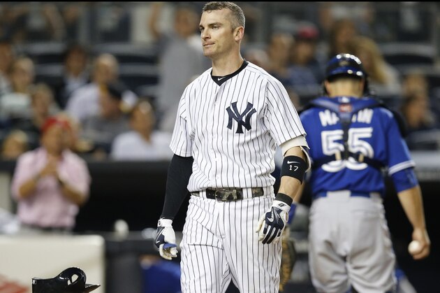New York Yankees' Brendan Ryan tosses his helmet after striking out on a foul tip in the fourth inning of a baseball game against the Toronto Blue Jays at Yankee Stadium in New York, Friday, Sept. 11, 2015. (AP Photo/Kathy Willens)