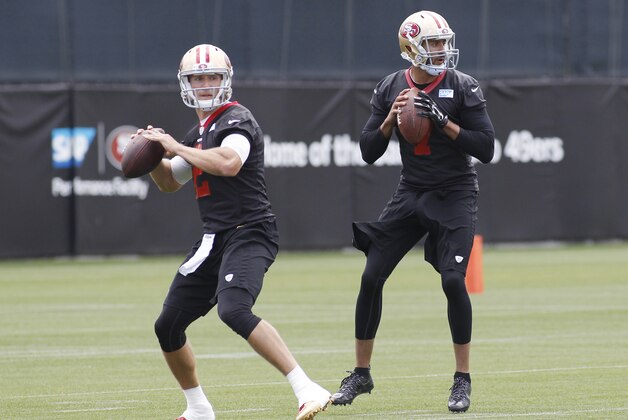San Francisco 49ers quarterbacks Blaine Gabbert, left, and Colin Kaepernick look to pass during NFL football practice, Thursday, May 21, 2015, in Santa Clara, Calif. (AP Photo/George Nikitin) San Francisco 49ers quarterbacks Blaine Gabbert, left, and Colin Kaepernick look to pass during NFL football practice, Thursday, May 21, 2015, in Santa Clara, Calif. (AP Photo/George Nikitin)