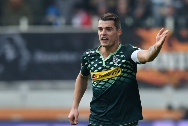 Moenchengladbach's Swiss midfielder Granit Xhaka plays the ball during the German first division Bundesliga football match of FC Augsburg vs Borussia Moenchengladbach in Augsburg, southern Germany, on February 28, 2016.

RESTRICTIONS: DURING MATCH TIME: DFL RULES TO LIMIT THE ONLINE USAGE TO 15 PICTURES PER MATCH AND FORBID IMAGE SEQUENCES TO SIMULATE VIDEO. == RESTRICTED TO EDITORIAL USE == FOR FURTHER QUERIES PLEASE CONTACT DFL DIRECTLY AT + 49 69 650050 / AFP / CHRISTOF STACHE / RESTRICTIONS: DURING MATCH TIME: DFL RULES TO LIMIT THE ONLINE USAGE TO 15 PICTURES PER MATCH AND FORBID IMAGE SEQUENCES TO SIMULATE VIDEO. == RESTRICTED TO EDITORIAL USE == FOR FURTHER QUERIES PLEASE CONTACT DFL DIRECTLY AT + 49 69 650050
        (Photo credit should read CHRISTOF STACHE/AFP/Getty Images)