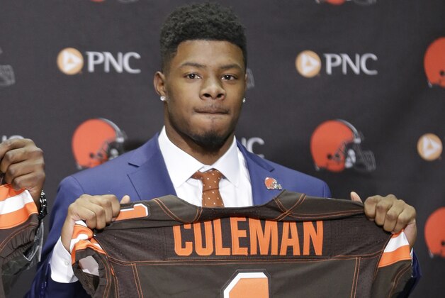 Cleveland Browns' Corey Coleman holds up a jersey during a news conference at the NFL football team's training camp facility, Saturday, April 30, 2016, in Berea, Ohio. Coleman played wide receiver at Baylor. (AP Photo/Tony Dejak)