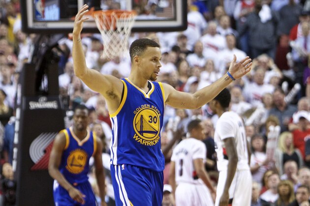Golden State Warriors guard Stephen Curry reacts after scoring a basket against the Portland Trail Blazers during the second half of Game 4 of an NBA basketball second-round playoff series Monday, May 9, 2016, in Portland, Ore. The Warriors won 132-125. (AP Photo/Craig Mitchelldyer)