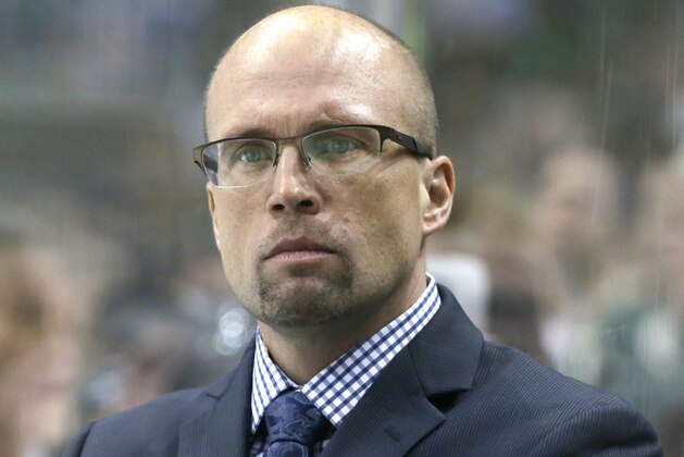 Minnesota Wild head coach Mike Yeo watches from the bench during the first period of an NHL hockey game against the Dallas Stars Saturday, Jan. 9, 2016, in Dallas. (AP Photo/LM Otero)