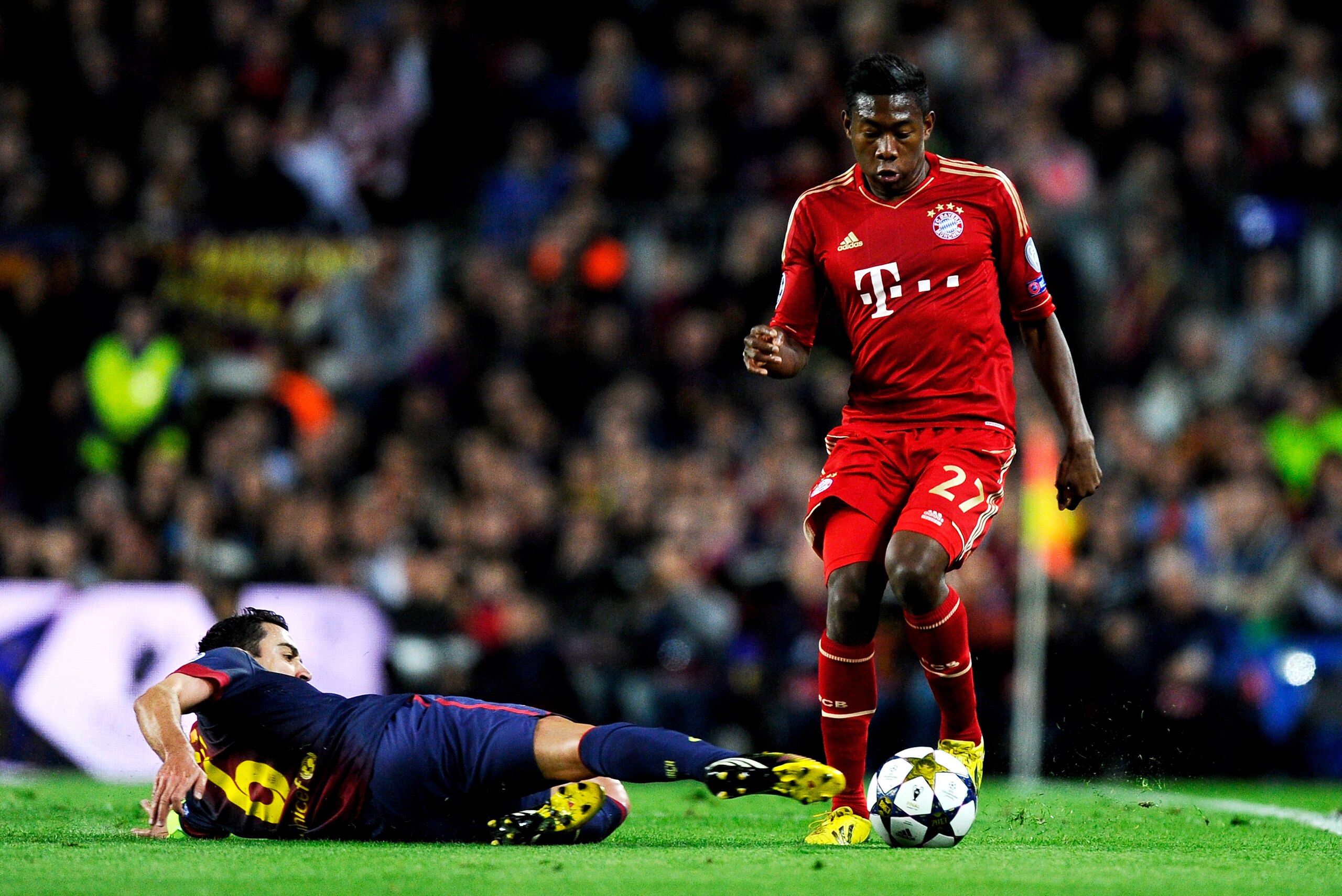 BARCELONA, SPAIN - MAY 01:  David Alaba of Munich is tackled by Xavi Hernandez of Barcelona during the UEFA Champions League semi final second leg match between Barcelona and FC Bayern Muenchen at Nou Camp on May 1, 2013 in Barcelona, Spain.  (Photo by David Ramos/Getty Images)