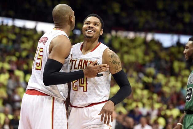 Apr 16, 2016; Atlanta, GA, USA; Atlanta Hawks center Al Horford (15) and forward Kent Bazemore (24) reacts after a late foul by the Boston Celtics during the second half in game one of the first round of the NBA Playoffs at Philips Arena. Mandatory Credit: John David Mercer-USA TODAY Sports
