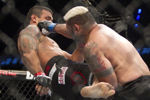 New Zealand's Mark Hunt, right,  battles against Brazil's Fabricio Werdum from during a UFC 180 interim Heavyweight title fight in Mexico City, Saturday, Nov. 15, 2014. Werdum won the fight by KO/TKO. (AP Photo/Christian Palma)