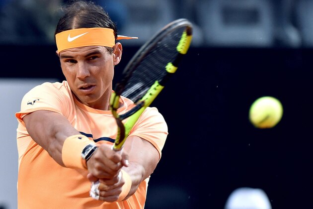 Rafael Nadal of Spain returns the ball to Philipp Kohlschreiber of Germany during their match at the Italian Open tennis tournament, in Rome, Wednesday, May 11, 2016. (Ettore Ferrari/ANSA via AP Photo) ITALY OUT