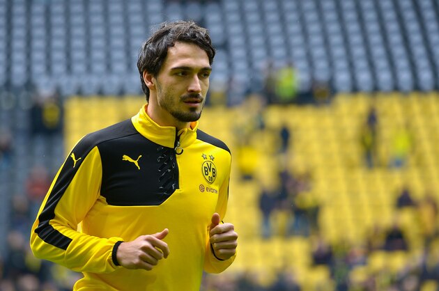 Dortmund's defender Mats Hummels warms up prior to the German first division Bundesliga football match Borussia Dortmund vs VfL Wolfsburg, in Dortmund, western Germany, on April 30, 2016. / AFP / Sascha SCHï¿½ï¿½RMANN / RESTRICTIONS: DURING MATCH TIME: DFL RULES TO LIMIT THE ONLINE USAGE TO 15 PICTURES PER MATCH AND FORBID IMAGE SEQUENCES TO SIMULATE VIDEO. == RESTRICTED TO EDITORIAL USE == FOR FURTHER QUERIES PLEASE CONTACT DFL DIRECTLY AT + 49 69 650050
        (Photo credit should read SASCHA SCHURMANN/AFP/Getty Images)
