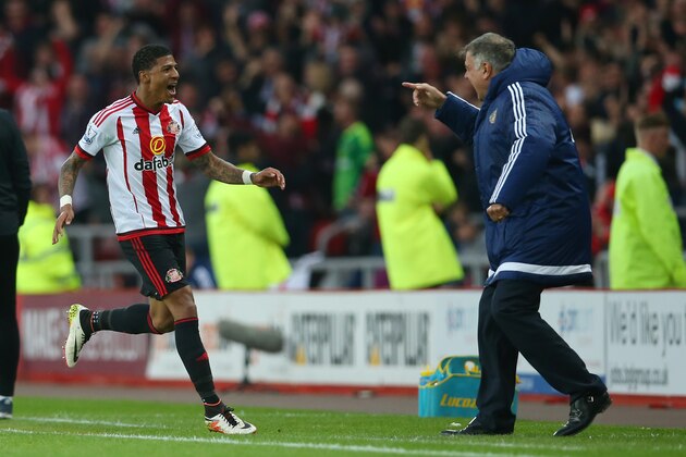 SUNDERLAND, ENGLAND - MAY 11:  Patrick van Aanholt of Sunderland celebrates scoring his team's opening goal with manager Sam Allardyce during the Barclays Premier League match between Sunderland and Everton at the Stadium of Light on May 11, 2016 in Sunderland, England.  (Photo by Ian MacNicol/Getty Images)