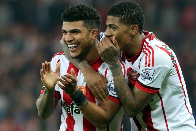 Sunderland's US defender DeAndre Yedlin (L) and Sunderland's Dutch defender Patrick van Aanholt celebrate after a 3-0 victory at the end of the English Premier League football match between Sunderland and Everton at the Stadium of Light in Sunderland, north east England on May 11, 2016. / AFP / SCOTT HEPPELL / RESTRICTED TO EDITORIAL USE. No use with unauthorized audio, video, data, fixture lists, club/league logos or 'live' services. Online in-match use limited to 75 images, no video emulation. No use in betting, games or single club/league/player publications.  /         (Photo credit should read SCOTT HEPPELL/AFP/Getty Images)
