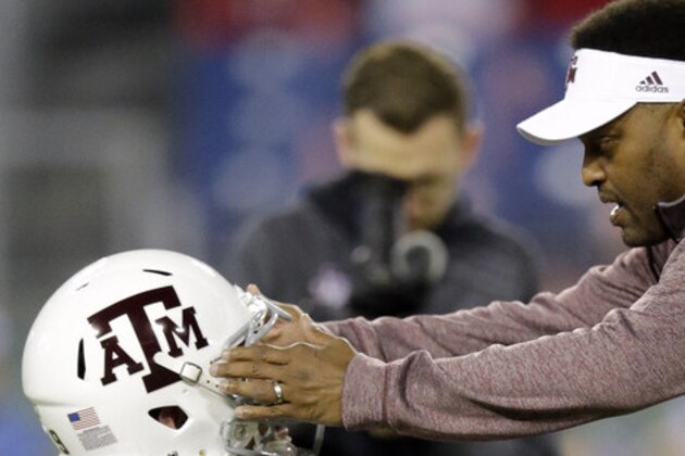 Texas A&M head coach Kevin Sumlin talks with offensive lineman Joseph Cheek before the Music City Bowl NCAA college football game against Louisville Wednesday, Dec. 30, 2015, in Nashville, Tenn. (AP Photo/Mark Humphrey) Texas A&M head coach Kevin Sumlin talks with offensive lineman Joseph Cheek before the Music City Bowl NCAA college football game against Louisville Wednesday, Dec. 30, 2015, in Nashville, Tenn. (AP Photo/Mark Humphrey)