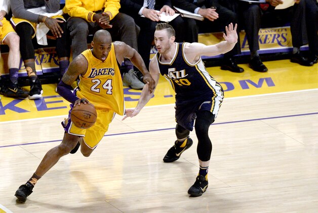 Kobe Bryant #24 of the Los Angeles Lakers drives on Gordon Hayward #20 of the Utah Jazz in the fourth quarter at Staples Center on April 13, 2016 in Los Angeles, California.  (Photo by Kevork Djansezian/Getty Images)