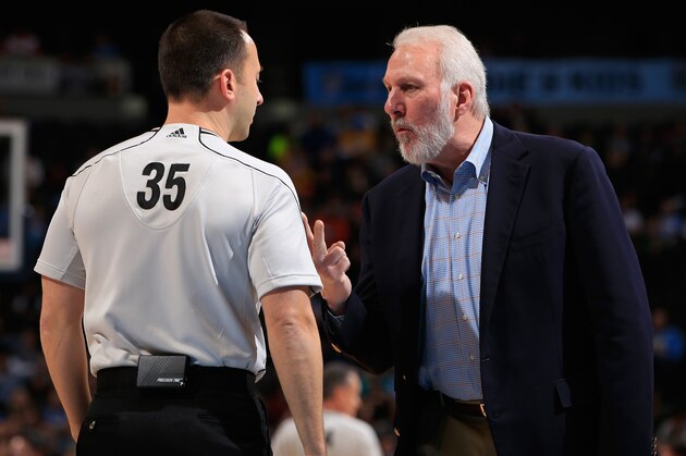DENVER, CO - DECEMBER 14:  Head coach Gregg Popovich of the San Antonio Spurs protests a call with referee Kane Fitzgerald #35 leading to a technical foul at Pepsi Center on December 14, 2014 in Denver, Colorado. NOTE TO USER: User expressly acknowledges and agrees that, by downloading and or using this photograph, User is consenting to the terms and conditions of the Getty Images License Agreement.  (Photo by Doug Pensinger/Getty Images)