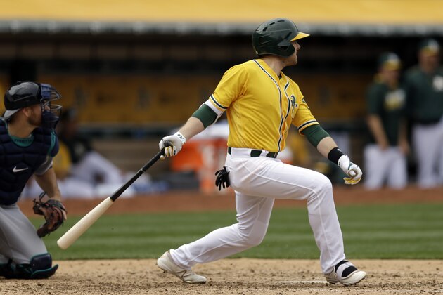 Oakland Athletics' Jed Lowrie swings for an RBI single in the fifth inning of a baseball game against the Seattle Mariners Wednesday, May 4, 2016, in Oakland, Calif. (AP Photo/Ben Margot)