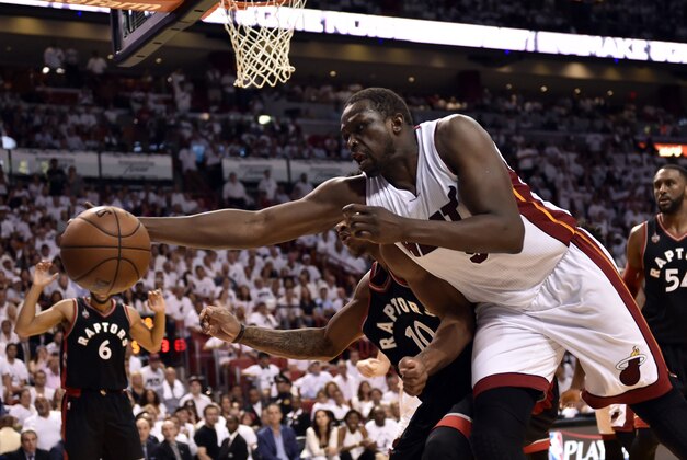 May 9, 2016; Miami, FL, USA; Miami Heat forward Luol Deng (9) reacts for a loose ball as Toronto Raptors guard DeMar DeRozan (10) defends during the fourth quarter in game four of the second round of the NBA Playoffs at American Airlines Arena. The Heat won in overtime 94-87. Mandatory Credit: Steve Mitchell-USA TODAY Sports