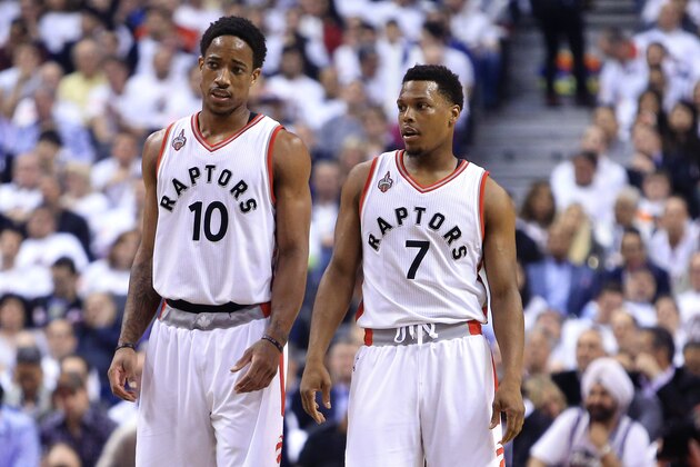 TORONTO, ON - MAY 11:  DeMar DeRozan #10 and Kyle Lowry #7 of the Toronto Raptors talk in the first half of Game Five of the Eastern Conference Semifinals against the Miami Heat during the 2016 NBA Playoffs at the Air Canada Centre on May 11, 2016 in Toronto, Ontario, Canada.  NOTE TO USER: User expressly acknowledges and agrees that, by downloading and or using this photograph, User is consenting to the terms and conditions of the Getty Images License Agreement.  (Photo by Vaughn Ridley/Getty Images)