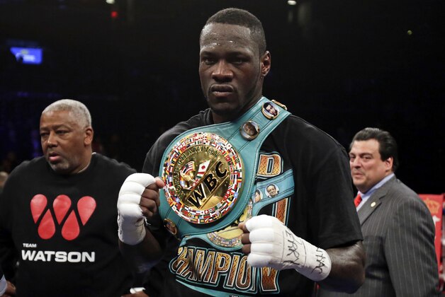 Jan 16, 2016; Brooklyn, NY, USA; Deontay Wilder celebrates after knocking out Artur Szpilka in the ninth round of their heavyweight title boxing fight at Barclays Center. Wilder defeated Szpilka via ninth round knockout. Mandatory Credit: Adam Hunger-USA TODAY Sports