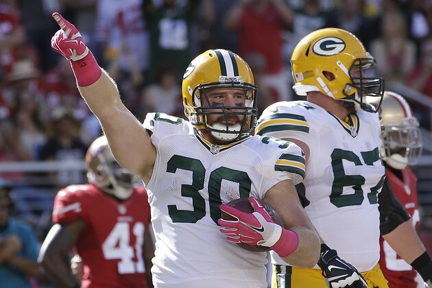 Green Bay Packers fullback John Kuhn (30) celebrates after scoring on a 1-yard touchdown run against the San Francisco 49ers during the second half of an NFL football game in Santa Clara, Calif., Sunday, Oct. 4, 2015. (AP Photo/Marcio Jose Sanchez)