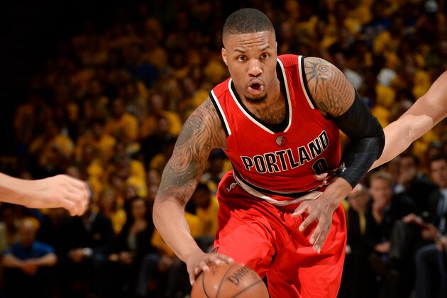 OAKLAND, CA - MAY 11: Damian Lillard #0 of the Portland Trail Blazers drives to the basket during the game against the Golden State Warriors in Game Five of the Western Conference Semifinals during the 2016 NBA Playoffs on May 11, 2016 at ORACLE Arena in Oakland, California. NOTE TO USER: User expressly acknowledges and agrees that, by downloading and or using this photograph, user is consenting to the terms and conditions of Getty Images License Agreement. Mandatory Copyright Notice: Copyright 2016 NBAE (Photo by Garrett Ellwood/NBAE via Getty Images)