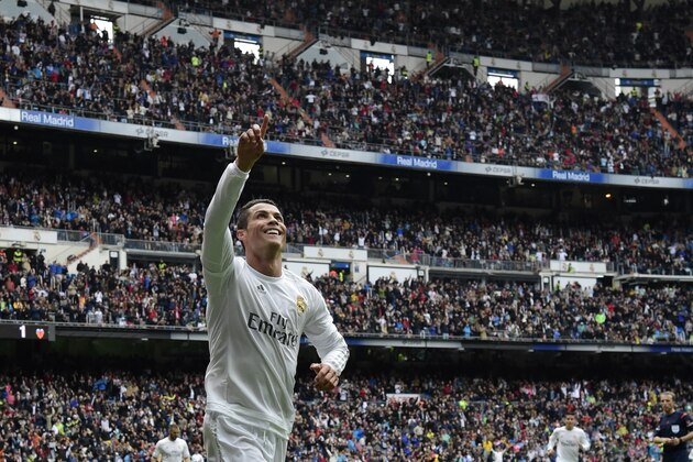 TOPSHOT - Real Madrid's Portuguese forward Cristiano Ronaldo celebrates after scoring a goal during the Spanish league football match Real Madrid CF vs Valencia CF at the Santiago Bernabeu stadium in Madrid on May 8, 2016. / AFP / JAVIER SORIANO        (Photo credit should read JAVIER SORIANO/AFP/Getty Images)