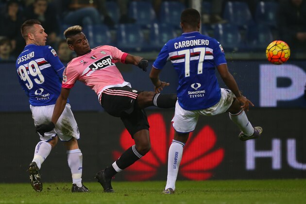 Juventus' French midfielder Paul Pogba (C) vies with Sampdoria's forward Antonio Cassano (L) during the Italian Serie A football match Sampdoria vs Juventus on January 10, 2016 at 'Luigi Ferraris Stadium' in Genoa. / AFP / MARCO BERTORELLO        (Photo credit should read MARCO BERTORELLO/AFP/Getty Images)