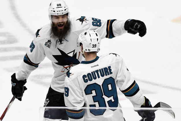 San Jose Sharks defenseman Brent Burns (88) celebrates with Logan Couture (39) after Couture scored a goal against the Nashville Predators during the third period in Game 6 of an NHL hockey Stanley Cup Western Conference semifinal playoff series, Monday, May 9, 2016, in Nashville, Tenn. The Predators won in overtime 4-3. (AP Photo/Mark Zaleski)