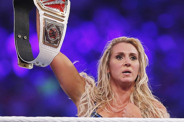 IMAGE DISTRIBUTED FOR WWE - WWE women's champion Charlotte celebrates her victory at WWE WrestleMania 32 at AT&T Stadium on Sunday, April 3, 2016, in Arlington, Texas. (Brandon Wade/AP Images for WWE)