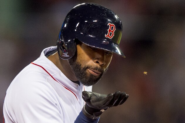 BOSTON, MA - MAY 11: Jackie Bradley Jr. #25 of the Boston Red Sox swats away a bug during the fifth inning of a game against the Oakland Athletics on May 11, 2016 at Fenway Park in Boston, Massachusetts. (Photo by Billie Weiss/Boston Red Sox/Getty Images)