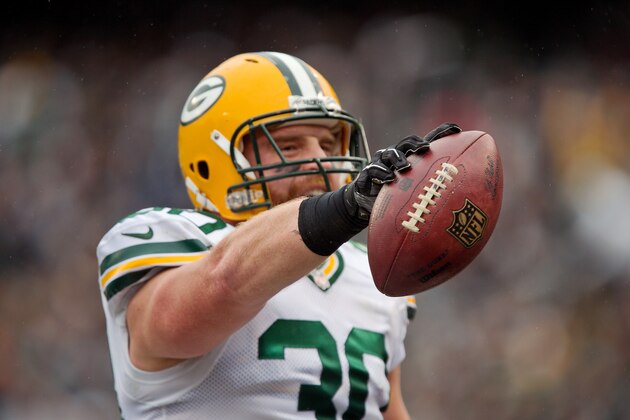 OAKLAND, CA - DECEMBER 20:  Fullback John Kuhn #30 of the Green Bay Packers celebrates his 5-yard touchdown against the Oakland Raiders in the first quarter on December 20, 2015 at O.co Coliseum in Oakland, California.  The Packers won 30-20. (Photo by Brian Bahr/Getty Images)